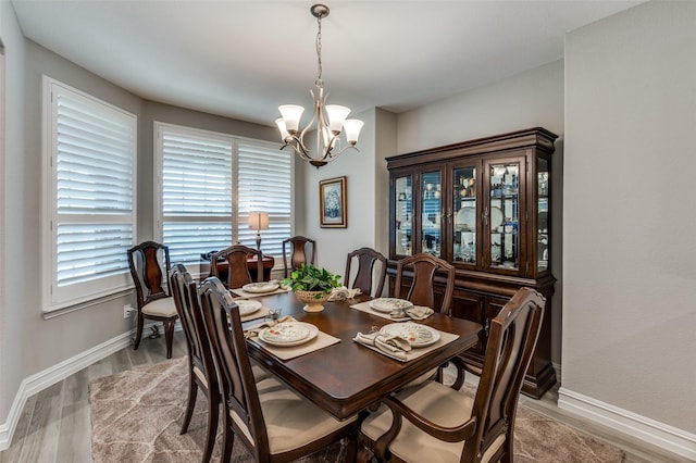 1116 Cornerstone Dr, Little Elm, TX 76227 - dining area with a chandelier and light wood finished floors