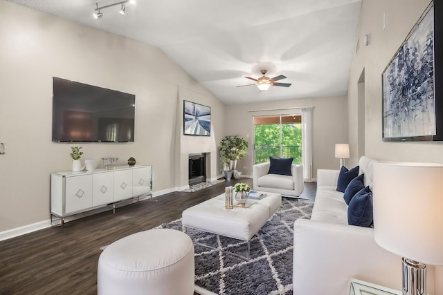 6050 Melody Ln Unit 341, Dallas, TX 75231 - living area with dark wood finished floors, a fireplace, ceiling fan, and vaulted ceiling
