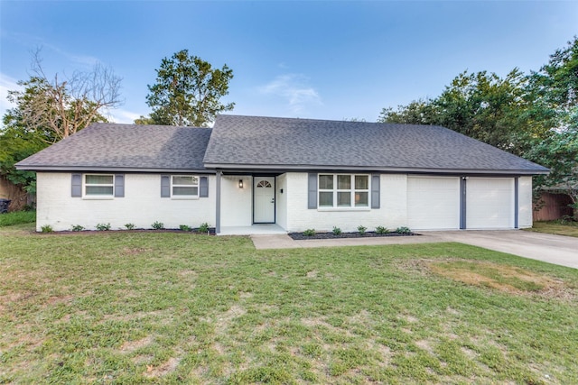 329 Chateau Dr, Fort Worth, TX 76134 - view of front of house with an attached garage, roof with shingles, concrete driveway, brick siding, and a front lawn