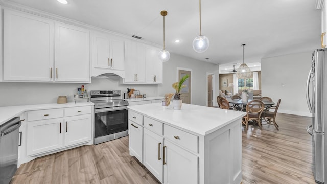 1381 County Road 1470, Chico, TX 76431 - kitchen featuring appliances with stainless steel finishes, light wood-style floors, light countertops, white cabinetry, and recessed lighting