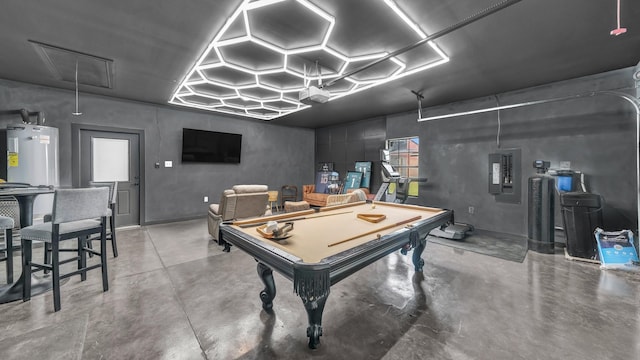 1381 County Road 1470, Chico, TX 76431 - rec room with concrete flooring, attic access, electric panel, pool table, and water heater
