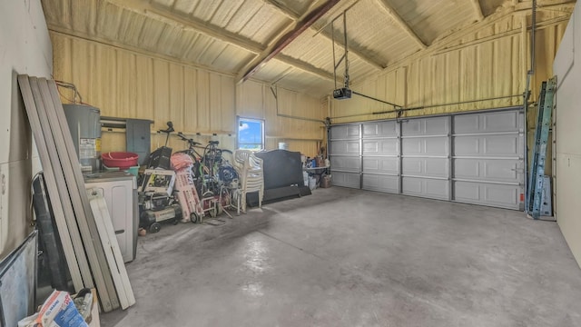 1381 County Road 1470, Chico, TX 76431 - garage with a garage door opener, water heater, and electric panel