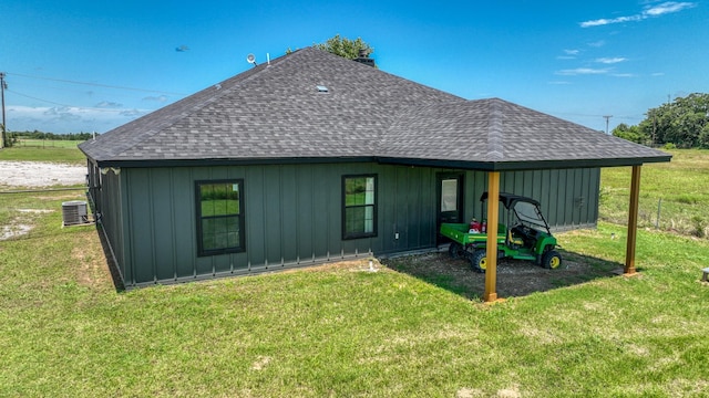 1381 County Road 1470, Chico, TX 76431 - back of property with a shingled roof, board and batten siding, and a lawn
