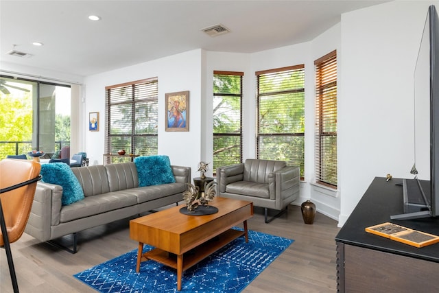 4333 Gilbert Ave Unit 330, Dallas, TX 75219 - living room with wood finished floors and recessed lighting