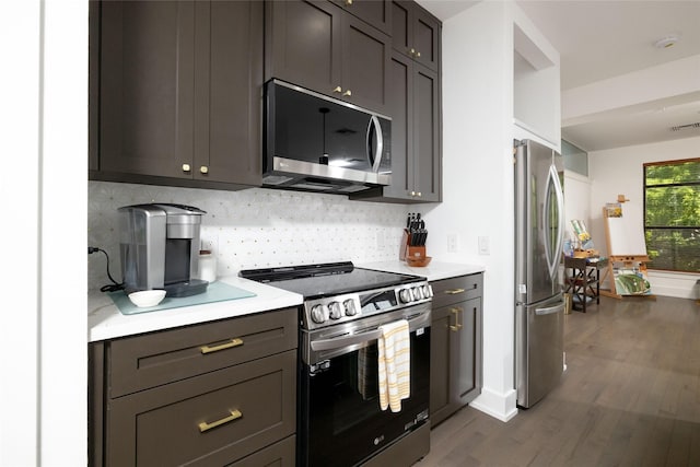 4333 Gilbert Ave Unit 330, Dallas, TX 75219 - kitchen with stainless steel appliances, light countertops, and decorative backsplash