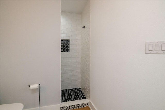 4333 Gilbert Ave Unit 330, Dallas, TX 75219 - bathroom featuring a tile shower