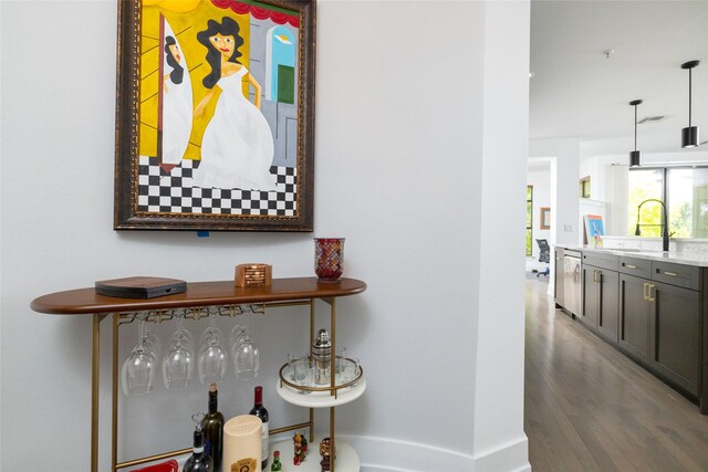 4333 Gilbert Ave Unit 330, Dallas, TX 75219 - hallway with a sink and wood finished floors