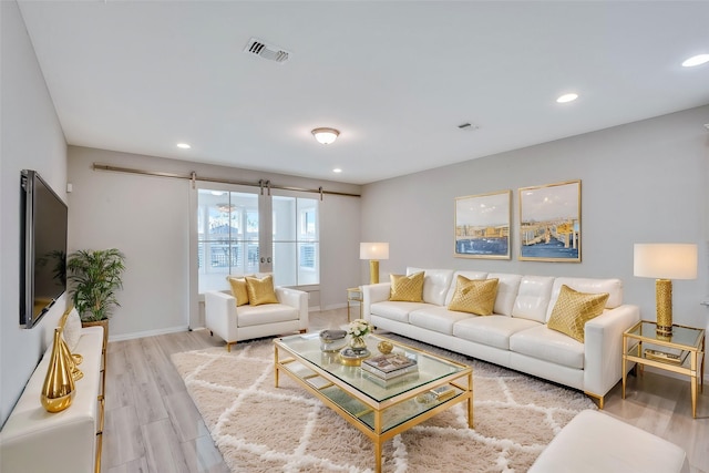 7616 Heritage Dr, Little Elm, TX 76227 - living area featuring light wood-style floors and recessed lighting
