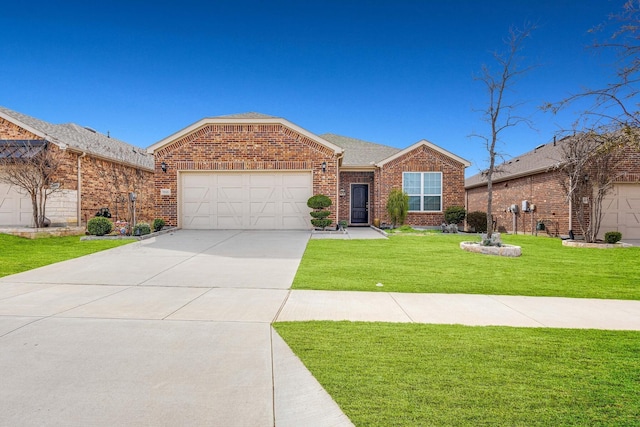 7616 Heritage Dr, Little Elm, TX 76227 - view of front of property with brick siding, an attached garage, a front yard, and concrete driveway