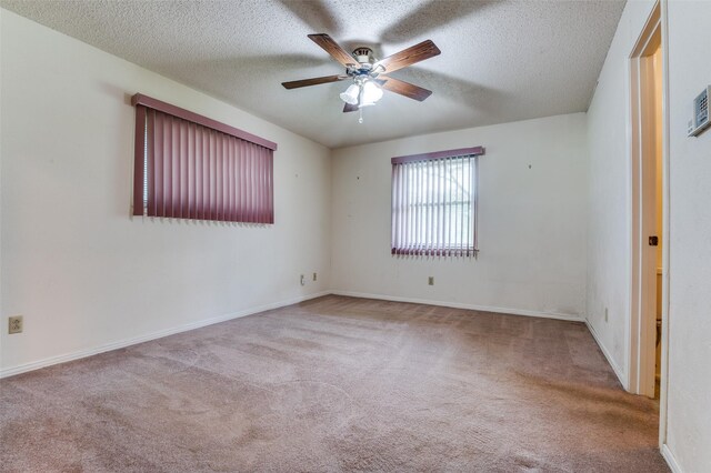 328 Bennett Cir, Desoto, TX 75115 - spare room featuring carpet, a ceiling fan, and a textured ceiling
