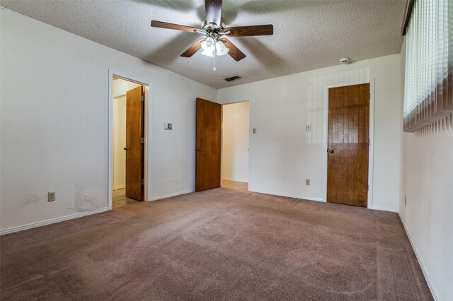 328 Bennett Cir, Desoto, TX 75115 - unfurnished bedroom featuring carpet floors, a textured ceiling, and a ceiling fan