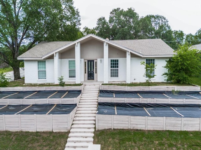 3836 Diamond Loch E, North Richland Hills, TX 76180 - view of front facade featuring uncovered parking and roof with shingles