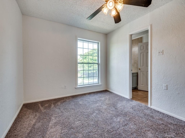 3836 Diamond Loch E, North Richland Hills, TX 76180 - carpeted empty room featuring a textured wall, a textured ceiling, and ceiling fan
