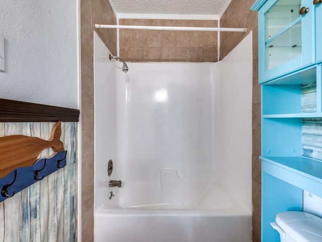 3836 Diamond Loch E, North Richland Hills, TX 76180 - full bathroom featuring bathtub / shower combination and a textured ceiling