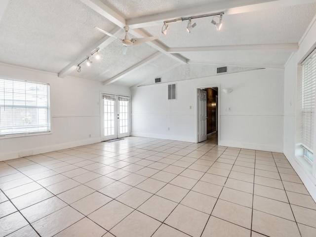 3836 Diamond Loch E, North Richland Hills, TX 76180 - unfurnished room with track lighting, a textured ceiling, light tile patterned floors, french doors, and ceiling fan