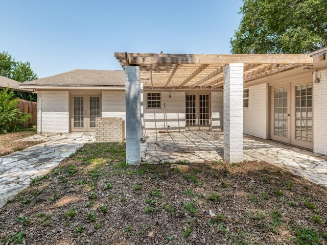 3836 Diamond Loch E, North Richland Hills, TX 76180 - back of house featuring french doors, brick siding, a patio, and a pergola
