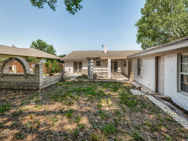 3836 Diamond Loch E, North Richland Hills, TX 76180 - rear view of house featuring french doors, a patio area, and brick siding