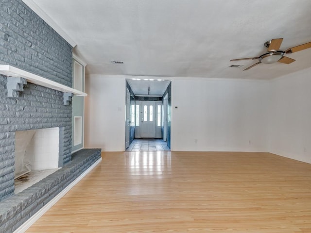 3836 Diamond Loch E, North Richland Hills, TX 76180 - unfurnished living room with wood finished floors, ceiling fan, and ornamental molding