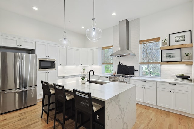 354 Foch St, Fort Worth, TX 76107 - kitchen featuring stainless steel appliances, ventilation hood, decorative backsplash, light stone countertops, and white cabinetry