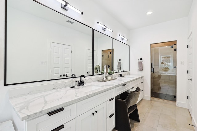 354 Foch St, Fort Worth, TX 76107 - bathroom with double vanity, a stall shower, tile patterned floors, and recessed lighting
