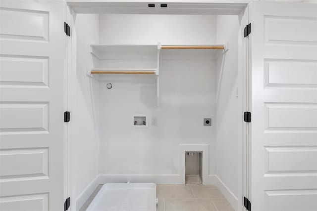 354 Foch St, Fort Worth, TX 76107 - washroom with washer hookup, hookup for an electric dryer, and light tile patterned floors