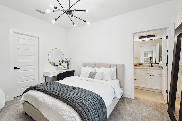 354 Foch St, Fort Worth, TX 76107 - bedroom with a chandelier, light carpet, and ensuite bath