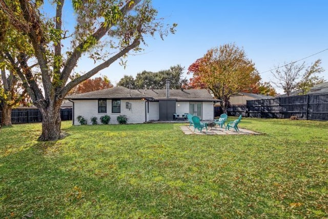 10669 Larchfield Ln, Dallas, TX 75238 - back of house featuring a fenced backyard, an outdoor fire pit, and a patio area