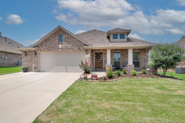 513 Endicott Dr, Sherman, TX 75092 - view of front facade featuring brick siding, an attached garage, driveway, and a front yard