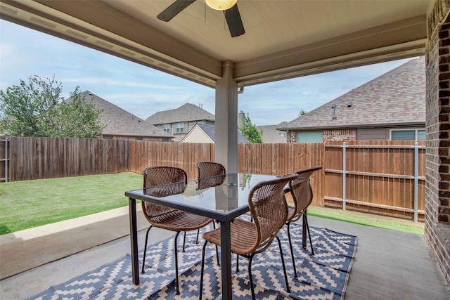 513 Endicott Dr, Sherman, TX 75092 - fenced backyard with ceiling fan, outdoor dining space, and a patio