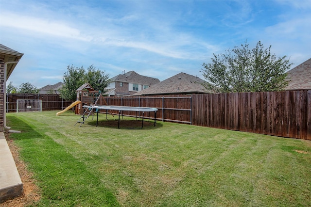 513 Endicott Dr, Sherman, TX 75092 - fenced backyard featuring a trampoline and a playground