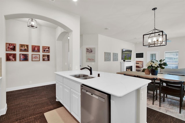 513 Endicott Dr, Sherman, TX 75092 - kitchen featuring dishwasher, arched walkways, a chandelier, white cabinets, and pendant lighting