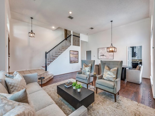 1728 Forest Glen Dr, Flower Mound, TX 75028 - living area featuring stairway, ornamental molding, wood finished floors, a chandelier, and recessed lighting