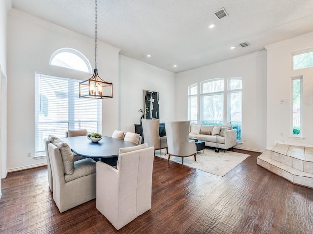 1728 Forest Glen Dr, Flower Mound, TX 75028 - dining room with dark wood-style flooring, a chandelier, crown molding, and recessed lighting