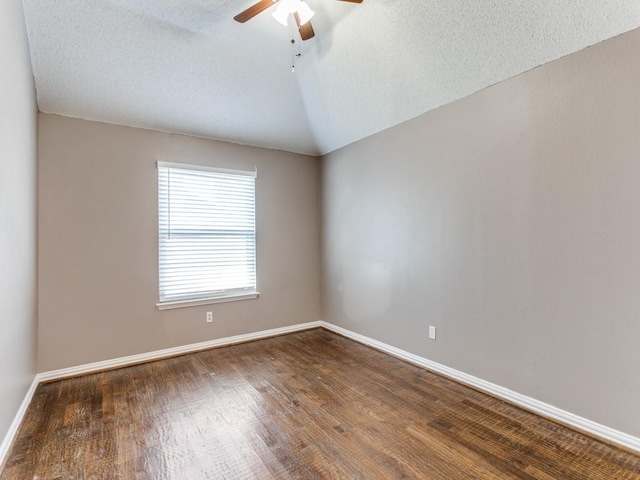 1728 Forest Glen Dr, Flower Mound, TX 75028 - spare room with ceiling fan, dark wood finished floors, a textured ceiling, and lofted ceiling