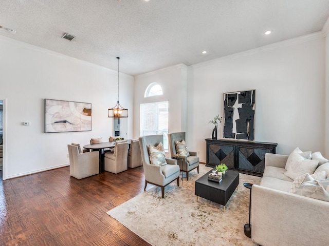1728 Forest Glen Dr, Flower Mound, TX 75028 - living area featuring wood finished floors, crown molding, recessed lighting, and a chandelier