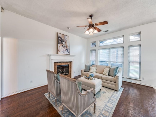 1728 Forest Glen Dr, Flower Mound, TX 75028 - living room featuring a ceiling fan, wood finished floors, a fireplace, and a textured ceiling