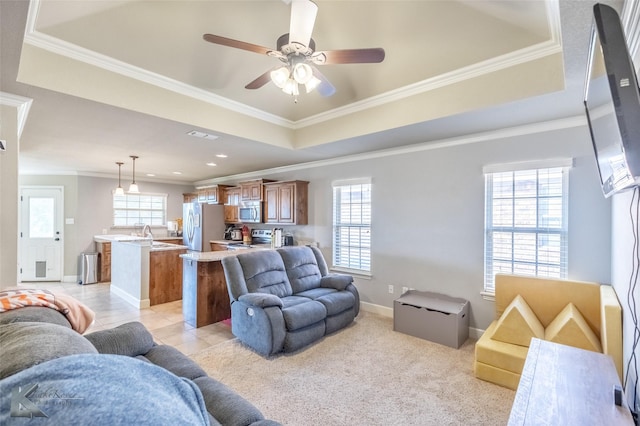 3501 Firedog Rd, Abilene, TX 79606 - living area featuring ornamental molding, a ceiling fan, a tray ceiling, and light tile patterned flooring
