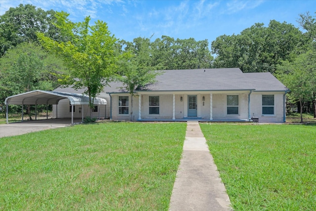 213 N Oaks Dr, Grand Saline, TX 75140 - single story home featuring a front lawn, concrete driveway, a carport, covered porch, and stucco siding
