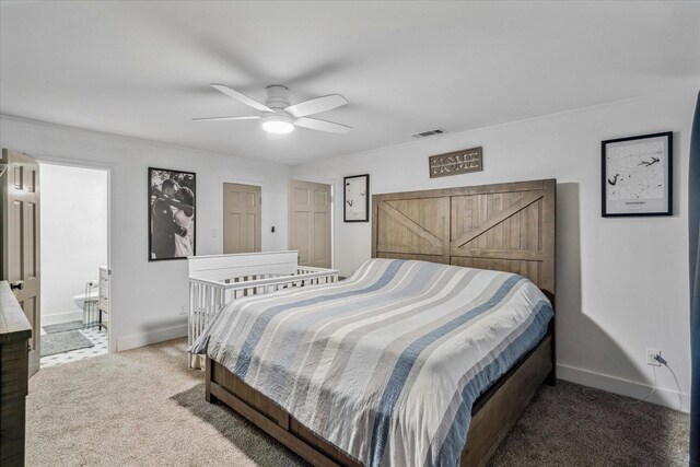 213 N Oaks Dr, Grand Saline, TX 75140 - bedroom with carpet floors, ceiling fan, and ensuite bath