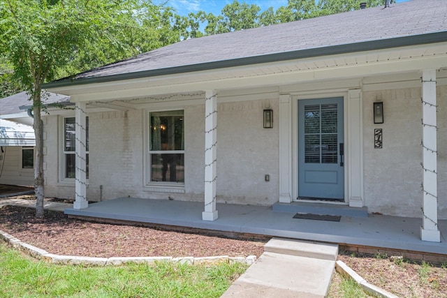 213 N Oaks Dr, Grand Saline, TX 75140 - doorway to property with a porch and a shingled roof