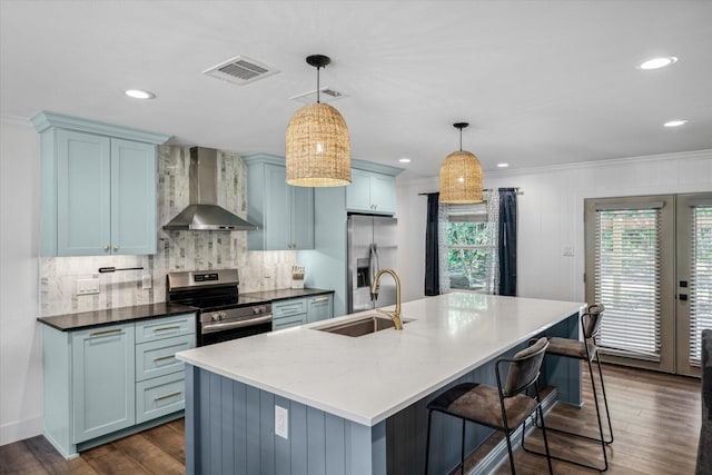 213 N Oaks Dr, Grand Saline, TX 75140 - kitchen featuring wall chimney exhaust hood, stainless steel appliances, plenty of natural light, decorative backsplash, and recessed lighting