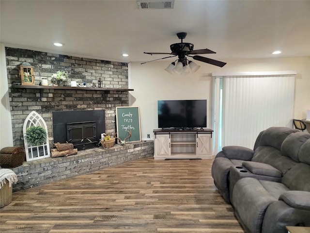 800 County Road 1030, Mount Pleasant, TX 75455 - living room featuring a ceiling fan, wood finished floors, a brick fireplace, and recessed lighting