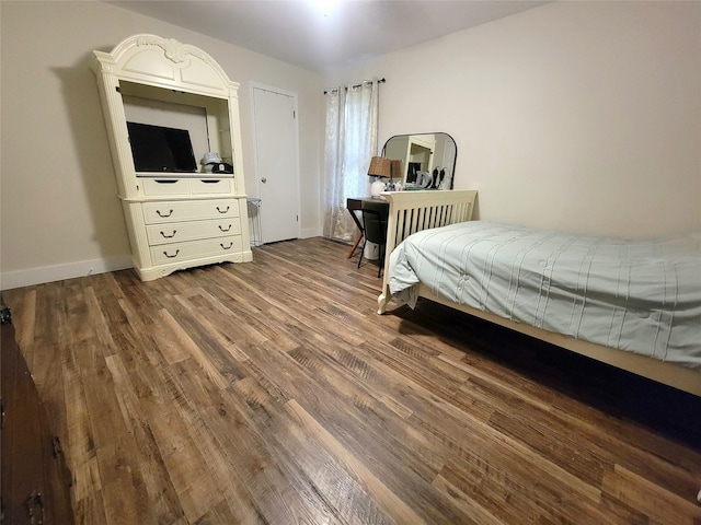 800 County Road 1030, Mount Pleasant, TX 75455 - bedroom featuring wood finished floors and baseboards