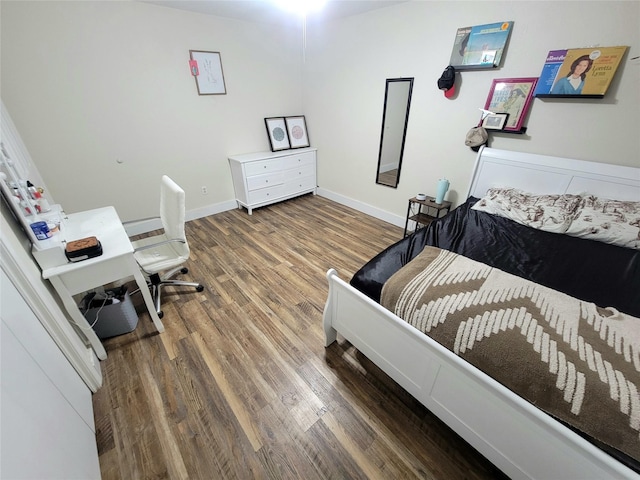 800 County Road 1030, Mount Pleasant, TX 75455 - bedroom featuring wood finished floors and baseboards