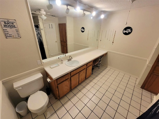 800 County Road 1030, Mount Pleasant, TX 75455 - bathroom featuring a textured ceiling, tile patterned floors, vanity, and a ceiling fan