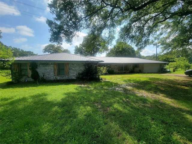 800 County Road 1030, Mount Pleasant, TX 75455 - view of front facade featuring a front lawn and a metal roof