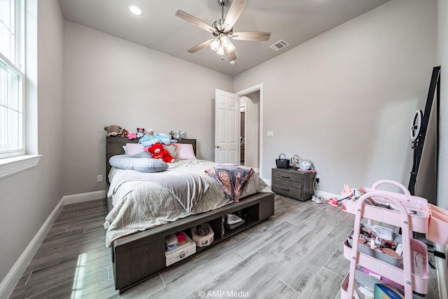 408 Lake Arbor Dr, Weatherford, TX 76088 - bedroom with wood finished floors, a ceiling fan, arched walkways, and recessed lighting