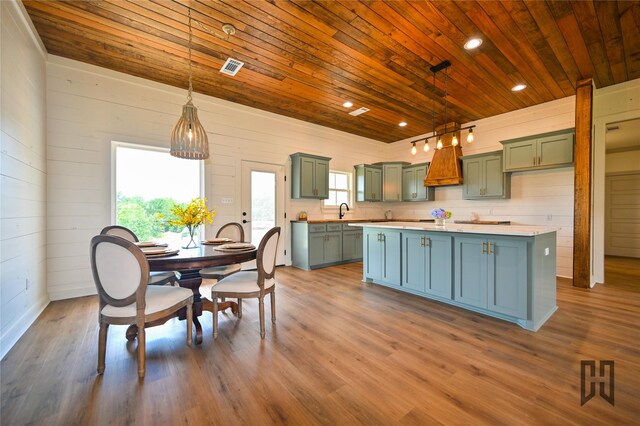 719 Germantown Rd, Minden, LA 71055 - kitchen with wooden ceiling, green cabinets, a kitchen island, light countertops, and dark wood-type flooring