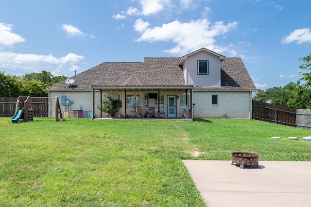 3120 Michele Ct, Weatherford, TX 76088 - rear view of house featuring an outdoor fire pit, a patio area, brick siding, a fenced backyard, and a playground