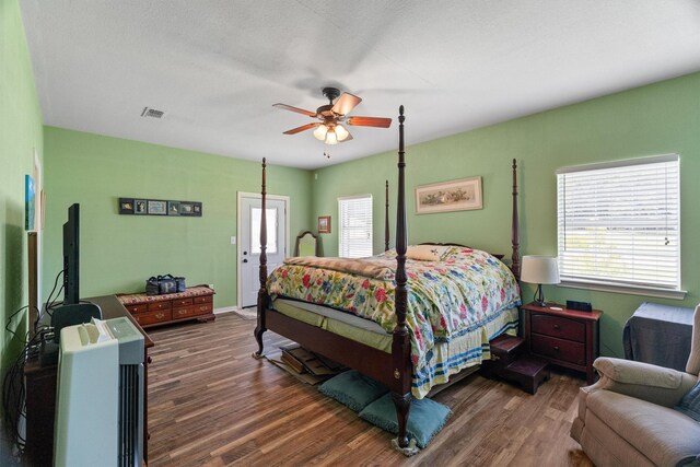 3120 Michele Ct, Weatherford, TX 76088 - bedroom with multiple windows, wood finished floors, and a ceiling fan